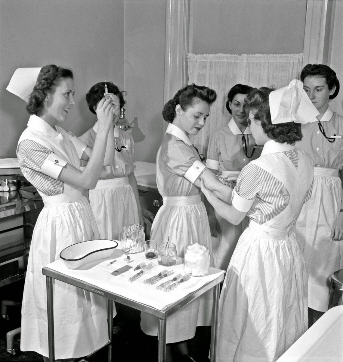 Nurse training. In New York City's School of Nursing Residence, advanced students give the Schick and Dick test (for Diphtheria and Scarlet Fever, respectively) to the probationers, 1942